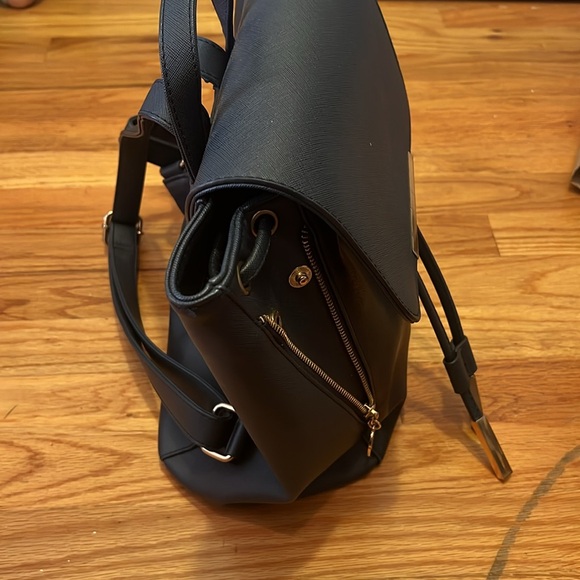 Stylish blue faux leather backpack with ample space for essentials! - Picture 2 of 6